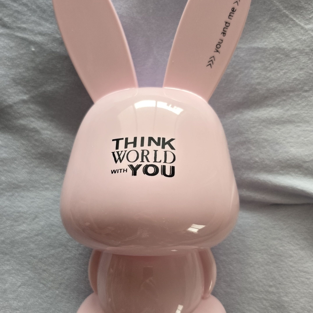Pink Mumuso cartoon rabbit piggy bank featuring the phrase "Think World with You